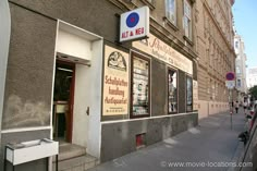 an outside view of a building with signs on the front and side windows that read atel - de - mer