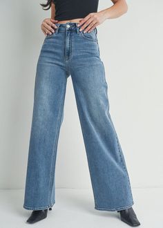 The top trending Tiktok style for spring '24 has arrived. Carefully designed with our soft signature denim this ultra high-rise jean is intended to stretch comfortably. With a relaxed fit through the thigh, this pair finishes with an extravagant wide leg. 11'' Rise, 32'' Inseam, 10'' Opening. 93% Cotton 5% Polyester 2% Spandex. Model is wearing a size 26. Tiktok Style, Faux Leather Skirt, Low Iron, Wide Leg Denim, Sweater Blouse, High Rise Jeans, Top Trends, High Jeans, Denim Wash