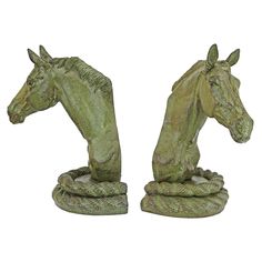 two statues of horses are shown side by side on a white background, one is green and the other is brown