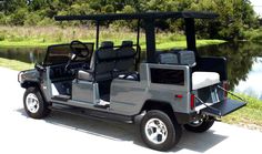 a golf cart parked next to a lake