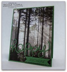 a birthday card with the words happy on it in front of some trees and fog