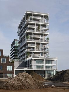 an apartment building with balconies on the top floor and balconies on the second floor