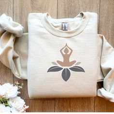 Yoga sweatshirt, yoga sweatshirt women, yoga clothes, meditation sweatshirt, spirituel sweatshirt,  yoga t-shirt, meditation tshirt, yoga gifts, spirituel gift, positive vibes, yoga lover gift, cute shirt for women, workout shirt  Sweatshirt details: Ideal for any situation, a unisex heavy blend crewneck sweatshirt is pure comfort. These garments are made from polyester and cotton. This combination helps designs come out looking fresh and beautiful. The collar is ribbed knit, so it retains its shape even after washing. There are no itchy side seams on these sweaters.  .: Made with a medium-heavy fabric blend of 50% cotton and 50% polyester (8.0 oz/yd² (271.25 g/m this sweatshirt feels cozy and is the perfect choice for those colder months. .: The classic fit along with the crew neckline de Yoga T Shirts Design, Yoga Tshirt Design, Yoga Sweatshirt, Fabric Paint Diy, Yoga Lover Gift, Sweatshirt Details, Yoga Design, Diy Clothes Design, Women Workout