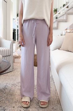 A easy to wear pant with a fun personality! The Sunset Lavender Drawstring Pants is a stretchy and comfy staple pant this season! Featuring crinkle fabric, lightweight feel, lavender color, elastic waistband, drawstring and a true to size fit. Style these amazing pants with a white tank top and comfy Birks! Details Crinkle fabric Lightweight Lavender color Elastic waistband Drawstring True to size fit Cameron is wearing a size S Fabric 97% Polyester 3% Spandex Sizing S Waist:28" Inseam:30" M Wai Crinkle Pants, Lavender Pants, Fun Personality, Crinkle Fabric, Lavender Color, Sweater Set, 21 Days, The Sunset, Drawstring Pants