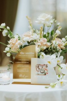 a table with flowers and cards on it