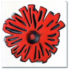 a red and black flower shaped object on a white background with the word's name below it