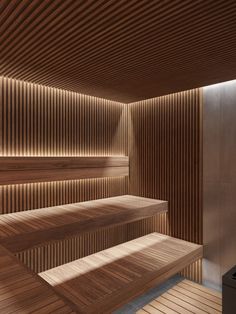 a room with wooden walls and benches in it