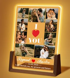 an illuminated photo frame with the words i love you and images of people on it