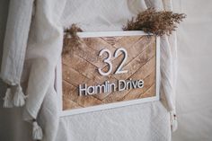 a sign that reads 32 hammin drive hanging on the wall