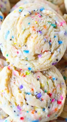 sprinkled cookies are piled on top of each other