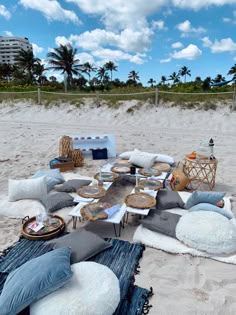 an outdoor seating area is set up on the beach