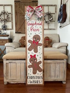 a wooden sign that says gingerbread kisses and two teddy bears with bows on it