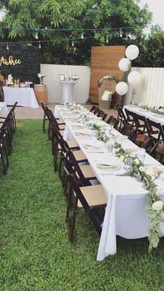 a long table set up for an outdoor party