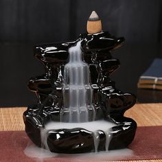 a fountain made out of black and white liquid