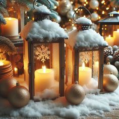 three lit candles sitting on top of snow covered ground next to christmas decorations and trees