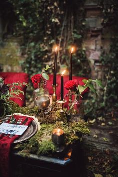 a table with candles and flowers on it