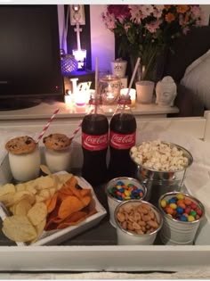 a tray with snacks and drinks on it