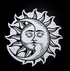 a drawing of the sun with a face on it's side, in black and white