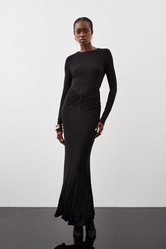 Undeniably Flattering, This Maxi Dress Is Crafted With Premium Fabric That Subtly Skims The Form. A Gathered Ruched Detail At The Waist And Back Adds Texture, While Long Sleeves And A Classic Round Crew Neck Ensure Modesty. A Lower Back Cut Out Detail Adds A Sultry Finish.Premium Stretch Crepe Jerseymaxi Lengthruched Detailsgathered Circle Designlong Sleeve Long Sleeve Black Maxi Dress Formal, Black Maxi Dress Formal, Long Fitted Dress, Long Sleeve Black Maxi Dress, Clothing Lookbook, Black Tie Dress Code, Cowgirl Closet, Black Tie Dresses, Eyes Style