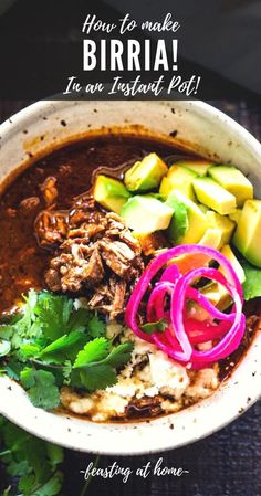 a bowl filled with meat and vegetables on top of a table