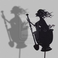 a silhouette of a woman with a hat and cane