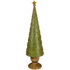 a small green christmas tree sitting on top of a table