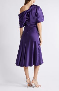 A graceful drape defines the chic silhouette of this toastworthy cocktail dress cut to a beloved midi length. 46 1/2" length (size 8) One-shoulder neck Elbow-length sleeves Lined 100% polyester Dry clean Imported Black Owned/Founded Formal A-line Midi Dress With Draped Sleeves, Pre-draped Knee-length Evening Midi Dress, Pre-draped Midi Dress With Draped Sleeves For Gala, Formal Pre-draped Knee-length Midi Dress, Elegant Purple Midi Dress For Evening, Silk Ruched Midi Evening Dress, Elegant Purple A-line Midi Dress, Evening Dresses With Ruched Bodice Tea Length, Satin Tea-length Evening Midi Dress