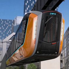 an orange and black train traveling through a city