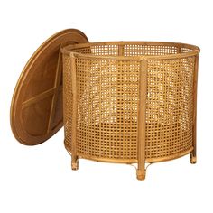 a round wicker basket with an open lid on the bottom and side, isolated against a white background