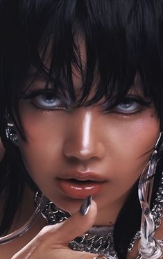 a close up of a woman with black hair and piercings on her head, wearing silver jewelry