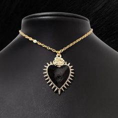 Black Enamel & Gold-plated Ornate Heart Pendant with Flower and Spike Trim. 2" Chain Extender.  Lobster Clasp.  CB159  #HEARTChoker #necklace #gothic #jewelry #sacredheart Goth punk fashion jewelry accessories rock blood alternative enamel love Day video Mexican sacred heart milagro evil eye all-seeing-eye enamel milagro Punk Black Necklace With Heart Pendant, Black Punk Heart Pendant Jewelry, Black Punk Heart Pendant Necklace, Punk Black Heart Pendant Necklace, Gothic Metal Heart Necklace, Punk Style Black Heart Pendant Necklace, Gothic Gold Heart-shaped Jewelry, Black Heart Pendant Edgy Jewelry, Gothic Gold Heart Jewelry