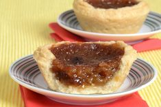 two small pies sitting on top of white plates