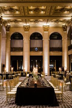 the tables are set up for a formal dinner in an ornately decorated room with chandeliers and candles