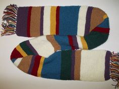 "Hand-knitted scarf inspired by the one Tom Baker wears as the Fourth Doctor in the classic television programme \"Doctor Who.\" Made from 100% acrylic yarn. Approximately 7 ft long, including 4 in tassels, and 7 in wide, or 2 m long, including 10 cm tassels, and 19 cm wide. MADE TO ORDER. TAKES 3-6 WEEKS TO COMPLETE. Shortened length for more manageable wear. If you are looking for the full-length version of this scarf: https://www.etsy.com/listing/95610763/doctor-who-tom-baker-scarf" Fourth Doctor, Tom Baker, Classic Television, Doctor Who, Acrylic Yarn, Scarf Wrap, Hand Knitting, Knitted Scarf, Scarf Accessory