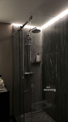 a walk in shower sitting next to a bathroom sink