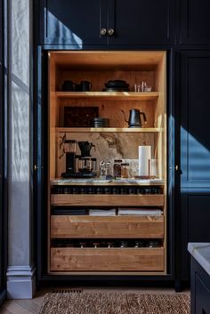 an open cabinet with many items in it