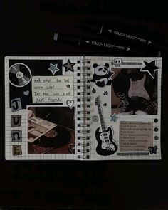 an open notebook with various pictures and words on the pages, including a guitar player