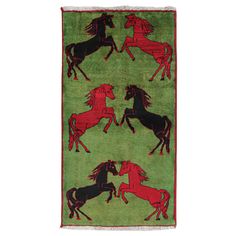 a green rug with horses on it