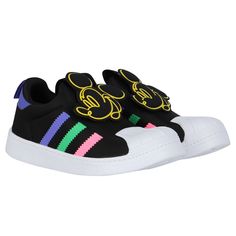 Black superstar 360 trainers for girls by adidas Originals. They feature purple panel on the heel tab with pull tab, have the iconic stripes on the side in pink, green and purple and cute minnie mouse on the tongue. Comfortable footbed and they have non slip white rubber soles. Comes with branded box.  #adidassuperstar360 #minniemousetrainers #girlssneakers #colorfuladidasshoes Black Superstar, Cute Minnie Mouse, Adidas Kids, Girls Black, Green And Purple, Adidas Originals, For Girls, Minnie Mouse, Adidas