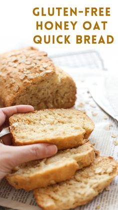 a person holding a loaf of gluten - free honey oat quick bread