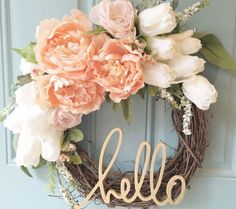 a wreath with flowers and the word hello on it