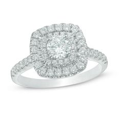 a diamond ring with two rows of diamonds on the band and an oval shaped center