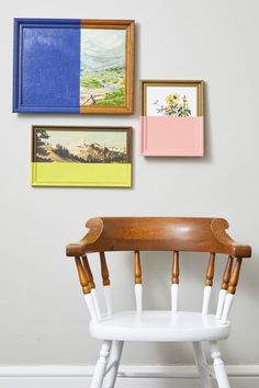 a white chair sitting in front of a wall with pictures on it's side