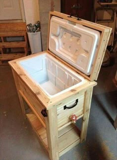 an ice chest sitting on top of a wooden table