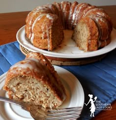 there is a bundt cake with icing on the plate and a fork next to it