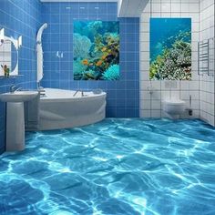 a bathroom with blue tiles and water flooring