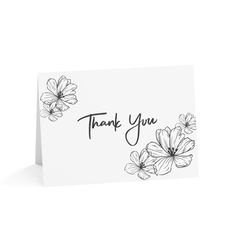 a thank card with black and white flowers on the front, that says thank you