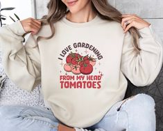 Tomato Sweatshirt, I Love Gardening From my Head Tomatoes,Graphic Tee,Vegetable Screen Print Sweater,Gardening Gift,Vegetable Sweater Hoodie DESCRIPTION: Elevate your fashion game with our exclusive products. This eye-catching piece seamlessly blends unique design with modern comfort, making it a must-have addition to your wardrobe. Our products offer a soft touch against your skin, providing breathability that ensures you stay comfortable throughout the day. Remember, it's not just clothing; it Vegetable Sweater, Sweatshirt Print, Gardening Gift, Love Garden, Print Sweater, Music Event, Printed Sweater, Printed Sweatshirts, Retro Design