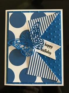 a blue and white birthday card with a butterfly on it