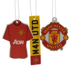 manchester united and manchester united badges hanging from strings